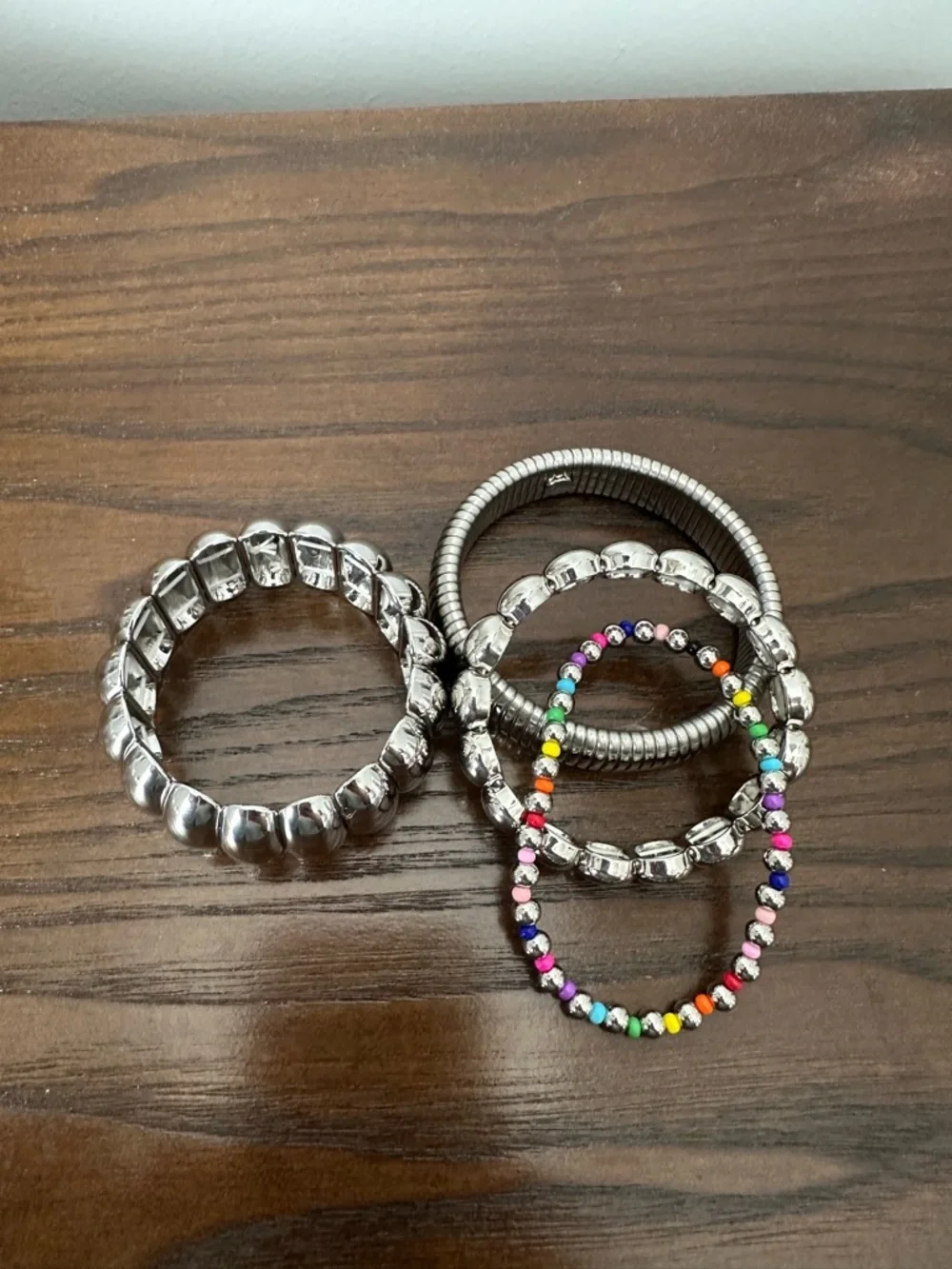 Set of Silver Tone Bangle Bracelets with Rainbow Beaded Accent - Picture 3 of 3